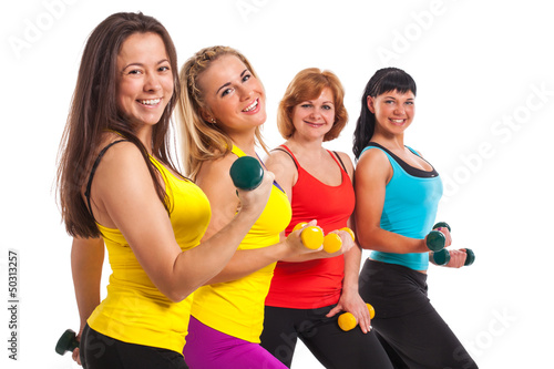 Photo: Group of women exercising over background Group of women exercising over background