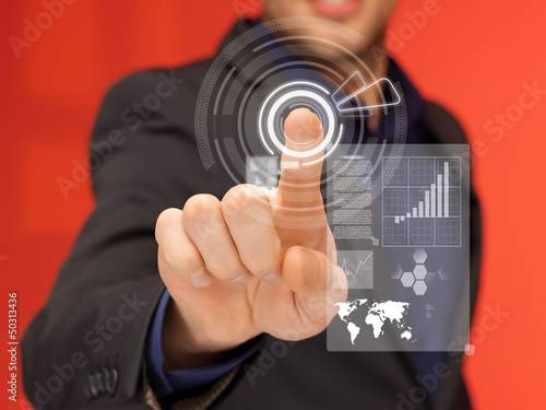 Photo: handsome man in suit pressing virtual button handsome man in suit pressing virtual button