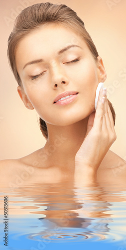 Photo: beautiful woman with cotton pad beautiful woman with cotton pad