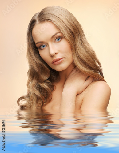 Photo: beautiful woman with long hair in water beautiful woman with long hair in water