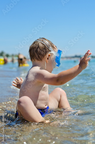 Photo: Little boy playing in the sea Little boy playing in the sea