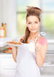 housewife with milk and cookies