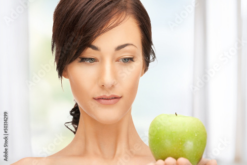 Photo: young beautiful woman with green apple young beautiful woman with green apple