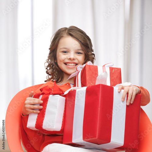 Photo: girl with gift boxes girl with gift boxes