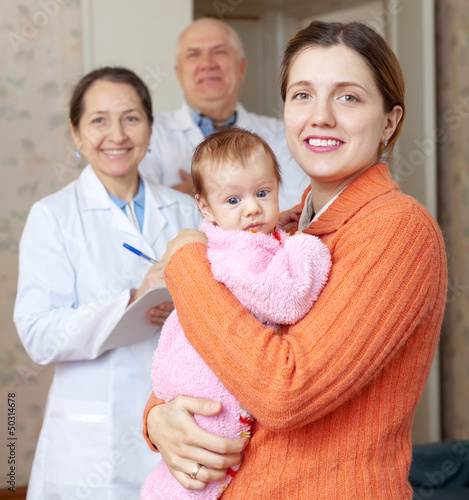Photo: Portrait of happy mother holding baby Portrait of happy mother holding baby