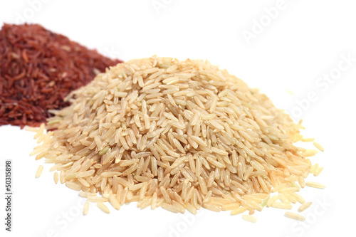 Photo: Pile of red and brown rice on white background Pile of red and brown rice on white background