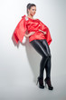 girl posing in red silk tunic and black leggings