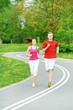 Photo: Young man and woman jogging outdoors Young man and woman jogging outdoors