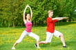 Photo: Fitness man and woman doing stretching exercises Fitness man and woman doing stretching exercises