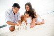 Family making sand castles