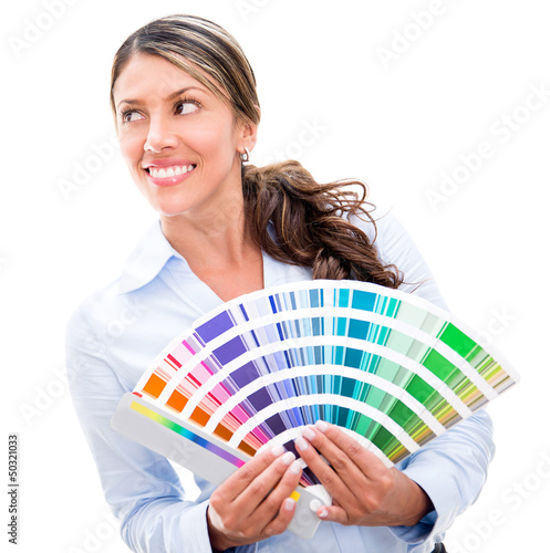 Photo: Thoughtful woman holding a color palette Thoughtful woman holding a color palette