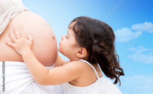 Photo: girl kissing mums belly girl kissing mums belly