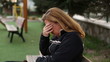 sad women sitting a bank, steady cam shoot