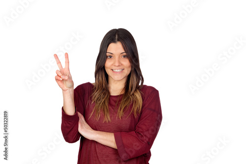 Photo: Attractive girl making the victory symbol Attractive girl making the victory symbol