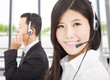 beautiful smiling businessman with call center agent