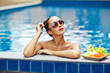 Young sexy woman in the pool