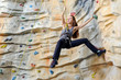 woman on rock wal