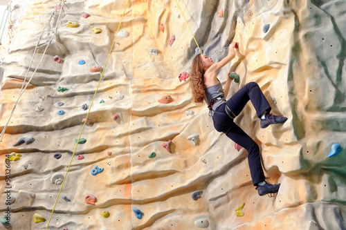 Photo: woman on rock wal woman on rock wal