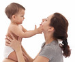 Baby touching mother's face.