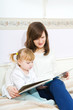 Mother and child reading book