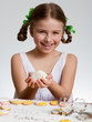 Photo: Happy easter - lovely girl making easter cookies Happy easter - lovely girl making easter cookies