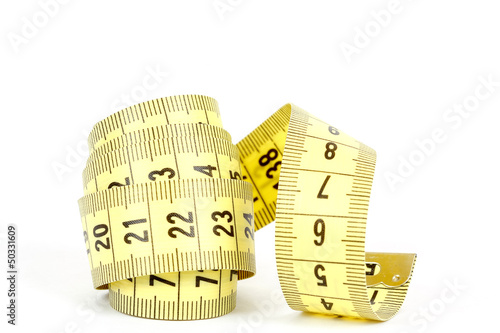 Photo: Yellow measuring tape isolated on white Yellow measuring tape isolated on white