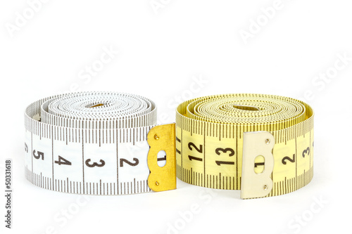 Photo: Yellow and white measuring tape isolated on white Yellow and white measuring tape isolated on white