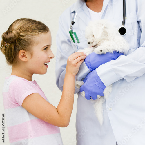 Photo: Veterinary care - lovely girl with maltese puppy to the vet Veterinary care - lovely girl with maltese puppy to the vet