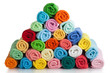 Set of colored towels on white.