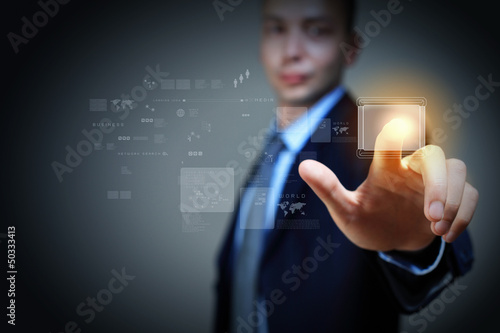 Photo: Business man touching display Business man touching display
