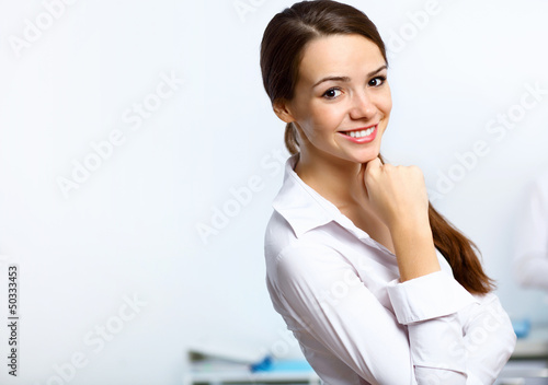 Photo: Young businesswoman in the office Young businesswoman in the office