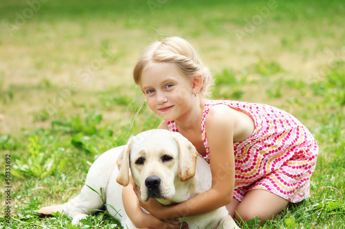 Photo: little girl with her dog little girl with her dog