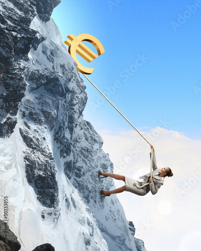 Photo: businesswoman climbing mountain businesswoman climbing mountain