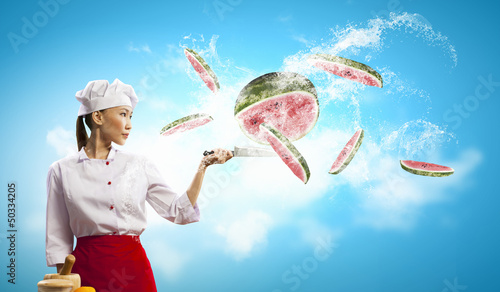 Photo: Asian female cook with knife Asian female cook with knife
