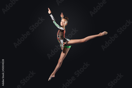 Photo: Young woman in gymnast suit posing Young woman in gymnast suit posing