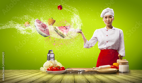 Photo: Asian female cook with knife Asian female cook with knife
