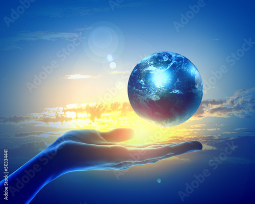Photo: Image of earth planet on hand Image of earth planet on hand