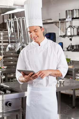 Photo: Male Chef Using Digital Male Chef Using Digital