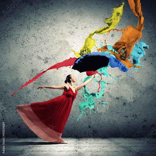 Photo: Ballet dancer in flying satin dress with umbrella Ballet dancer in flying satin dress with umbrella