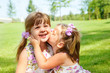 Girl kissing her sister