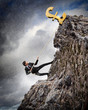 busiessman climbing mountain