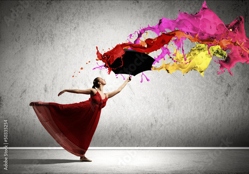 Photo: Ballet dancer in flying satin dress with umbrella Ballet dancer in flying satin dress with umbrella