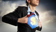 Businessman showing superman suit underneath shirt