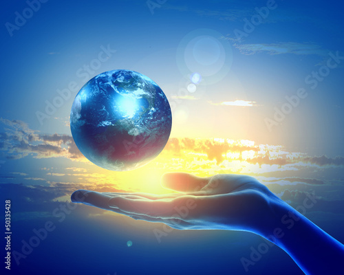 Photo: Image of earth planet on hand Image of earth planet on hand