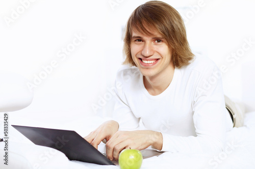 Photo: Young man with notebook Young man with notebook