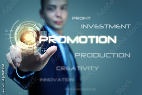 Photo: Business man touching display Business man touching display