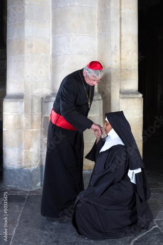 Photo: Nun kissing ring cardinal Nun kissing ring cardinal