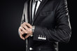 Close up of elegant man checking the time