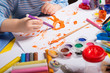 Hands of painting little boy