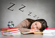 Girl sleeping on books